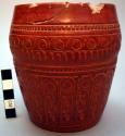 Ceramic jar, cylindrical, incised annular design, red, glazed, chipped.