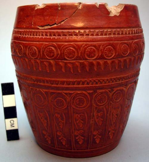 Ceramic jar, cylindrical, incised annular design, red, glazed, chipped.