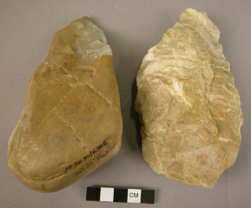2 quartzite hand axes on pebbles