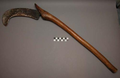 Billhook of wood and metal. Imsango