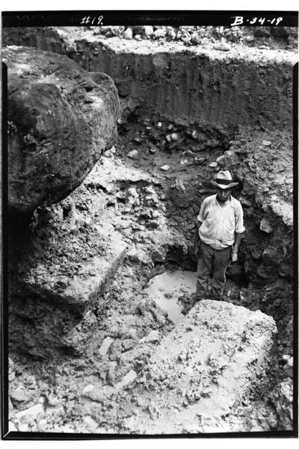 Excavating for new foundation to Stela I root of which shows at upper left. Seen