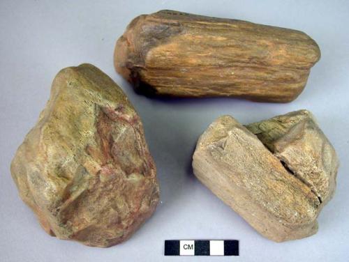 3 single steep-ended hand adzes of fossil wood