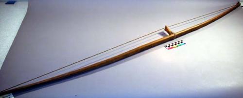 Wooden bow with wooden string guard and sinew bow string