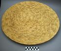 "Goondo", unbleached straw, 21" dia. most basic woven item, simplest to construc