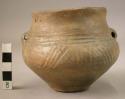 Ancient vessel; vase with low perforated handles