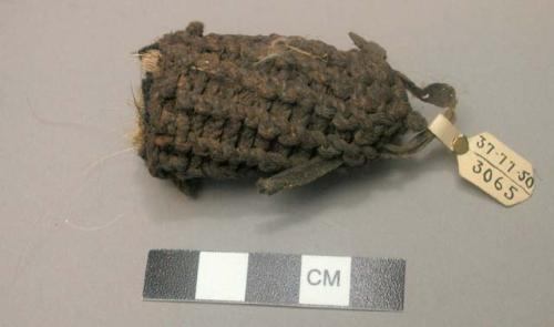 Fiber tuft - part of costume belonging to stone idol, no. 50/3054