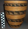 Lidless basket - jar shape, fine coiled weave, black stripes with worked triangu