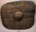 Shield - oval shape, fibre coiled around long strips of wood ("ngabo")