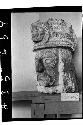 Angled view of sculptured head with headdress