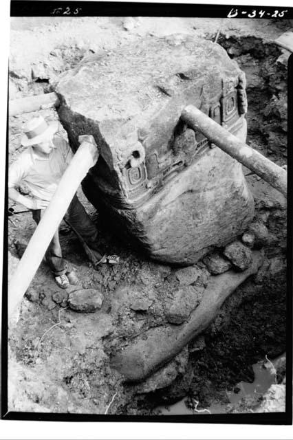 Butt of Stela J seen from Northwest showing huge foundation stone beneath