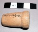 Wooden bottle stopper, in witch doctor's basket 39-64-50/3459
