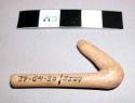 Miniature wooden hoe handle - belongs to series III of Witch Doctor's outfit for