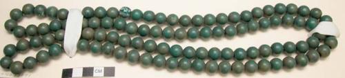 String of green, round, wooden beads