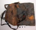 Leather pouch, partly decayed and hardened