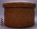 Heavy round basket with cover, made from "milala" palm leaf - called xitumbe