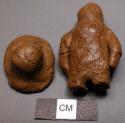Small clay human figure with detachable clay hat.  Muntu Made by boy under 14