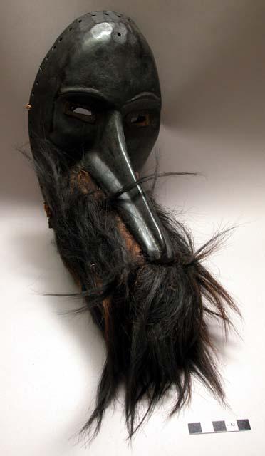 Black wooden mask with fur around snout (To la Ge) - comes to town when anyone