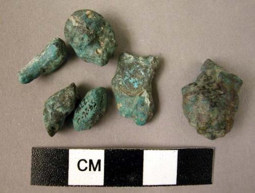 6 lumps of coppery malachite.