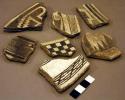 Ceramic rim and body sherds, black on white geometric designs