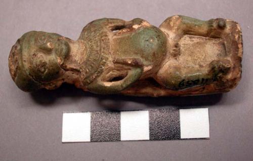 Statuette.  Perhaps a representation of the god Bes on the front. On the reverse is possibly Sekmut or Nut with outspread wings representing protection.