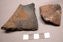 9 potsherds - black with white incisions