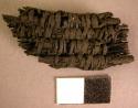 Fragment of burned basketry