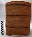 Basket, coiled weave, cylindrical in shape, 3 black stripes, kakabu