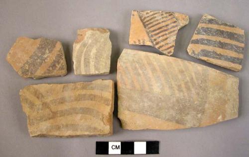 13 brown on buff painted ware sherds