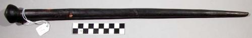 Staff, cylindrical, tapered end, conical knob with incised concentic circles