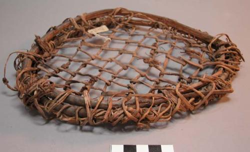 Hoop filled with coarse mesh of yucca leaf