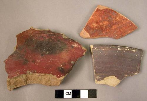 3 potsherds - red slip ware