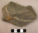 Crude quartzite flake, apparently used as chopper or perforator