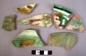 7 Sgraffito potsherds (2 restored) with green & brown running colors