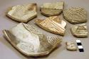 Ceramic rim and body sherds, red on white, black on white, geometric designs