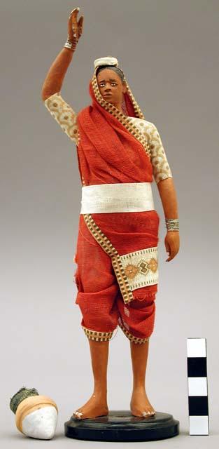 Figurine of hindu sweeper woman with basket on head (basket broken off)