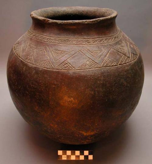 Red pottery vessel with incised designs. Nsuku