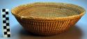 Basketry bowl, vine wrapped bark strips, flat base, spaces in weave, dk band