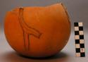 Gourd vessel with fiber string handle. cracks mended with string.  Chipanda
