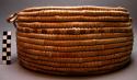 Heavy round basket with cover, made from "milala" palm leaf - called xitumbe