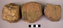 4 small double-ended hand adzes of fossil wood