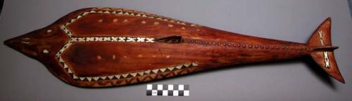 Wood carving of fish, probably a shark, abalone inlay, with cowrie +