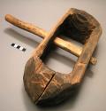 Two piece wooden shackle for use on the legs of enslaved people