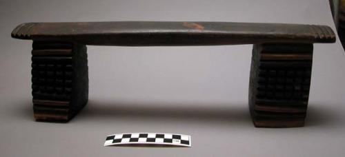 Wooden headrest; 2 legs; engraved & scalloped