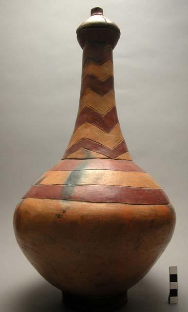 Tall long-necked water jug of pottery