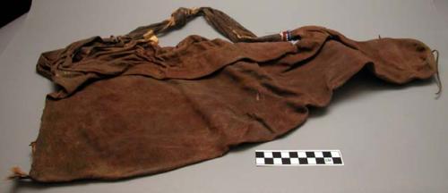 Skin bag to hold quivers; worn over shoulder; beads decorate handle; dyed skin