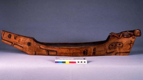 Canoe model with carved human figure