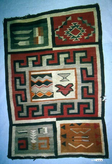 Five-in-one rug with pictorial and geometric designs