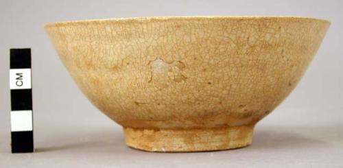 Grey-white ware bowl - greenish brown glaze; ring-shaped base