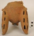 Red ware pottery tripod bowl - one leg and rim broken; long holes on legs