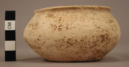 Small cream colored ware bowl - coarse, porous texture